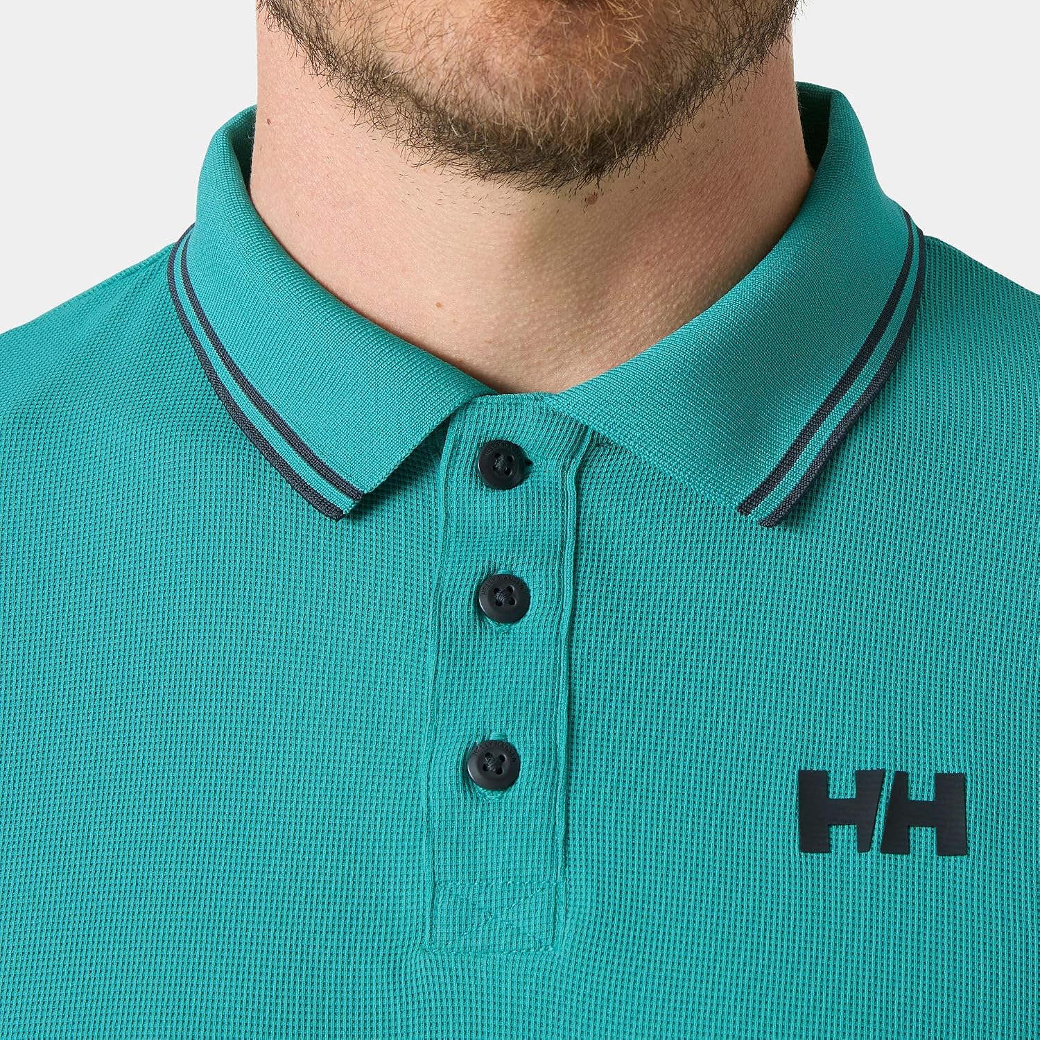 Detalle de Helly Hansen Uomo Polo Kos: polo classica a maniche corte dal tocco marino