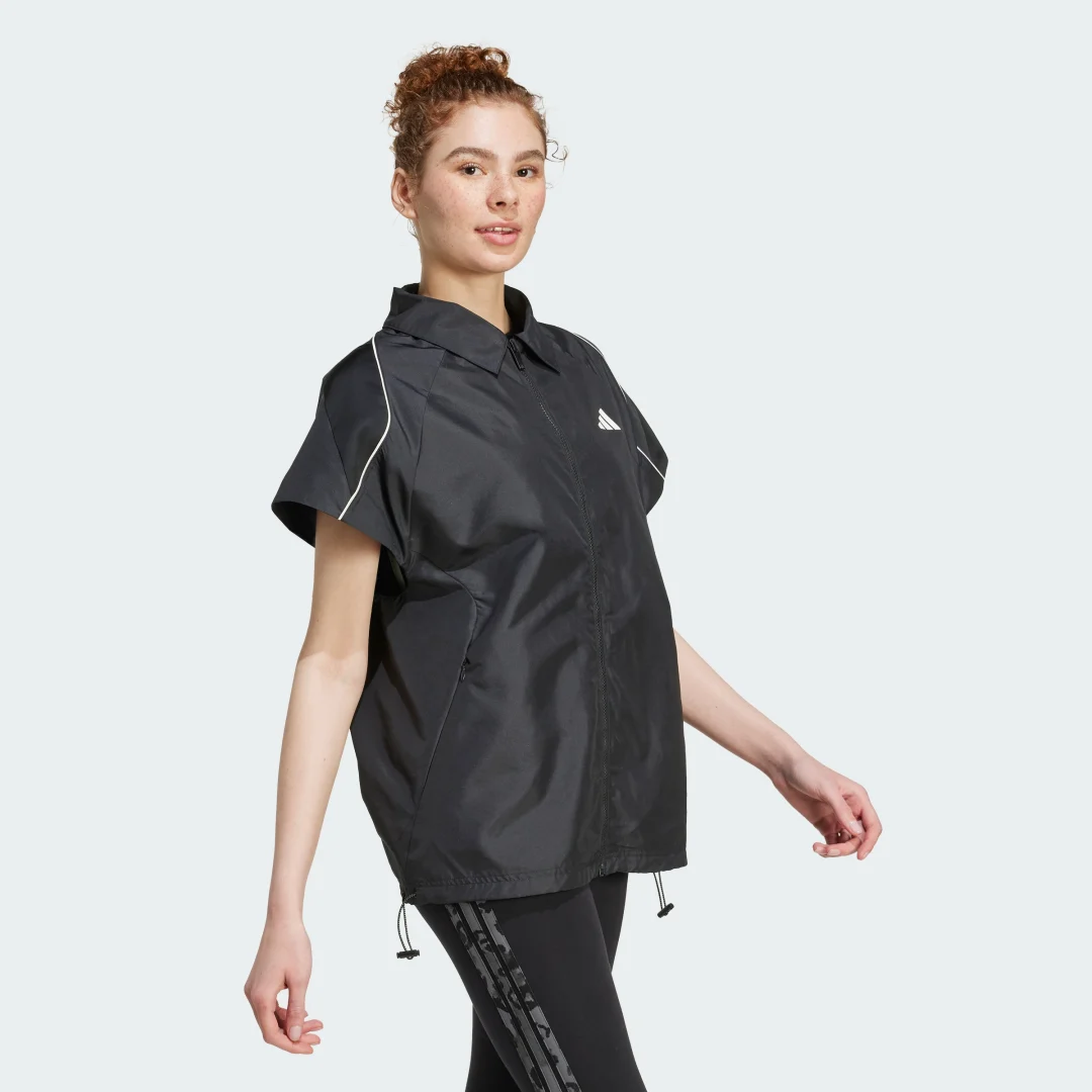 Detalle de Sobrecamisa Stadium de Adidas: negro atemporal para outfits casuales