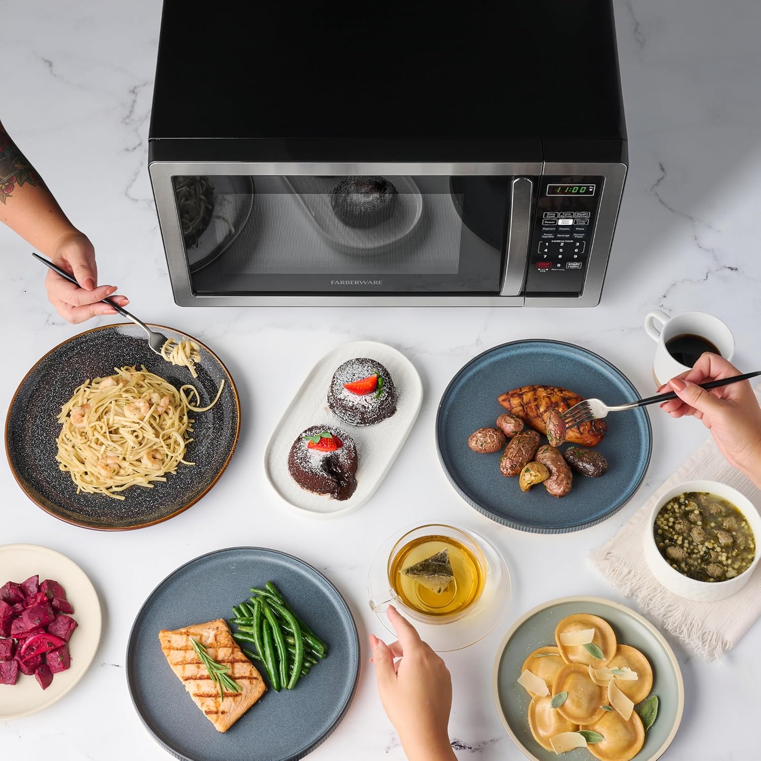 Detalle de Farberware 1.1 Cu. Ft. Countertop Microwave Oven (1000W) with Auto Cook, Defrost, Child Safety Lock — Stainless