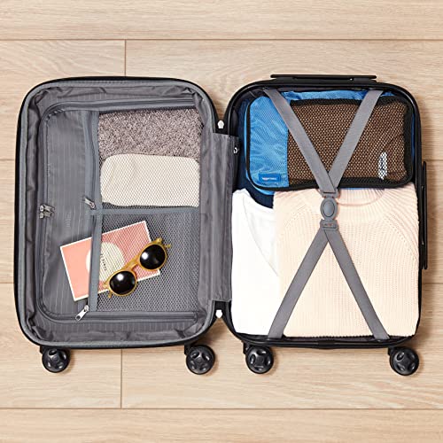 Detalle de Amazon Basics Maleta Rígida Mediana Extensible (68 × 45,1 × 28,6 cm) con 4 Ruedas – Negro