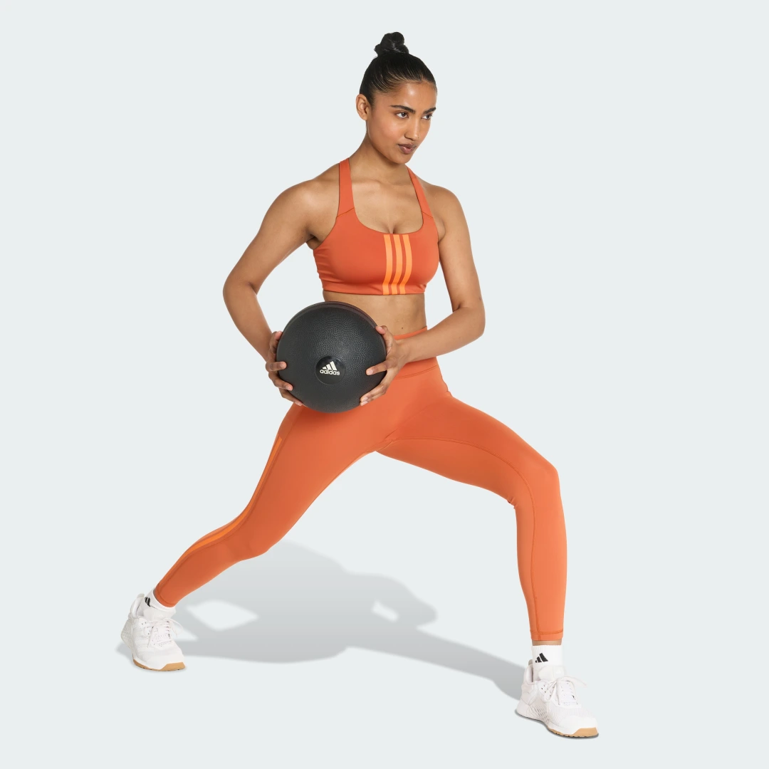 Detalle de Sujetador de entrenamiento Optime 3 Stripes de Adidas – impacto medio, color naranja