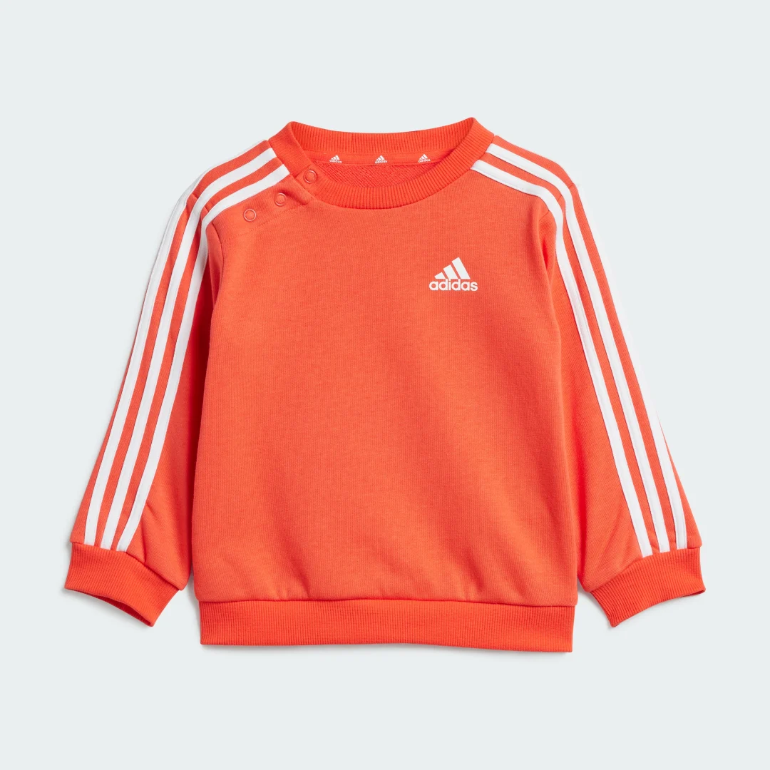 Detalle 2 de Conjunto Essentials 3 bandas (Bebé) de Adidas — sudadera y pantalón naranja