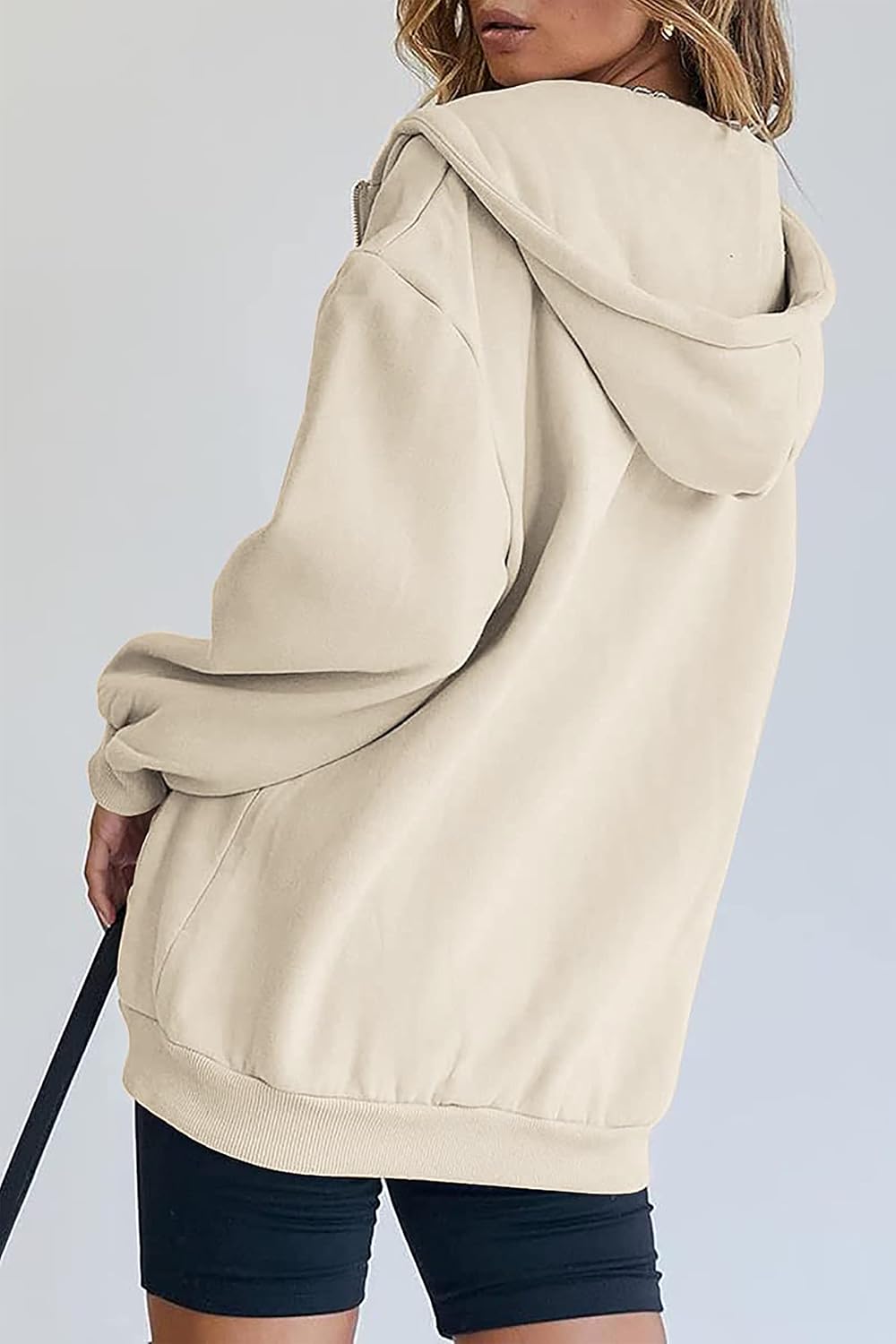 Detalle 1 de Timuspo damestrui met capuchon, lang oversized model met ritssluiting