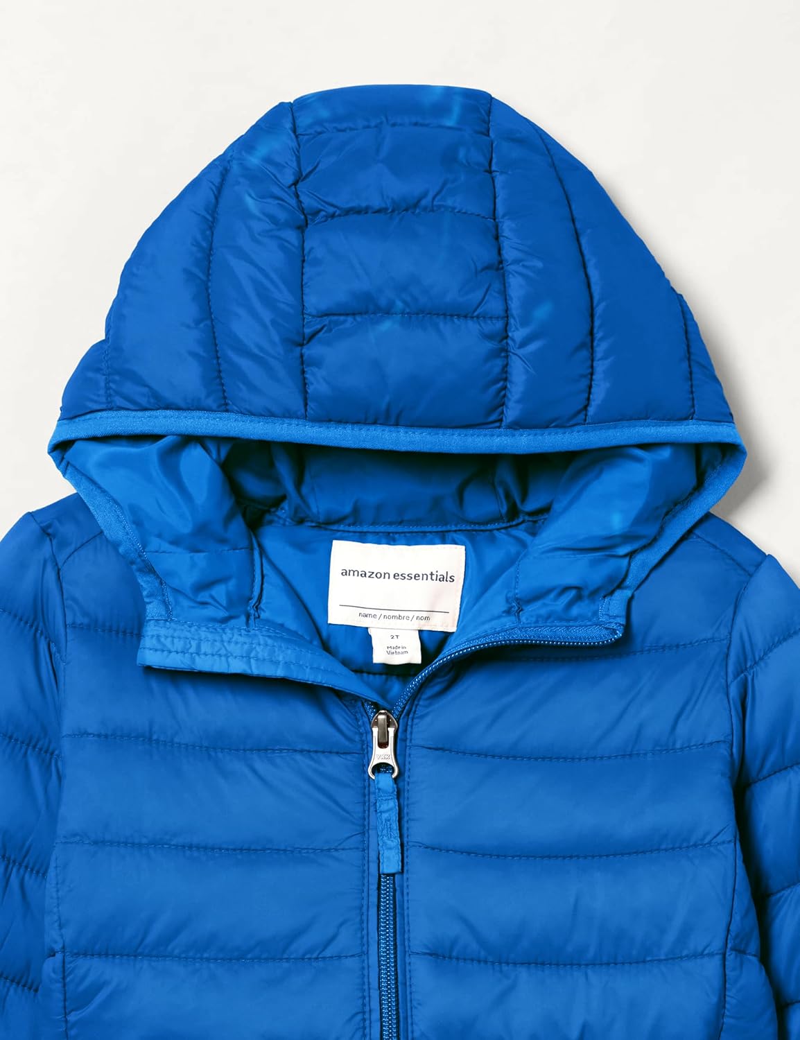 Detalle 2 de Amazon Essentials Jungen Leichte wasserdichte verstaubare Übergangsjacke mit Kapuze