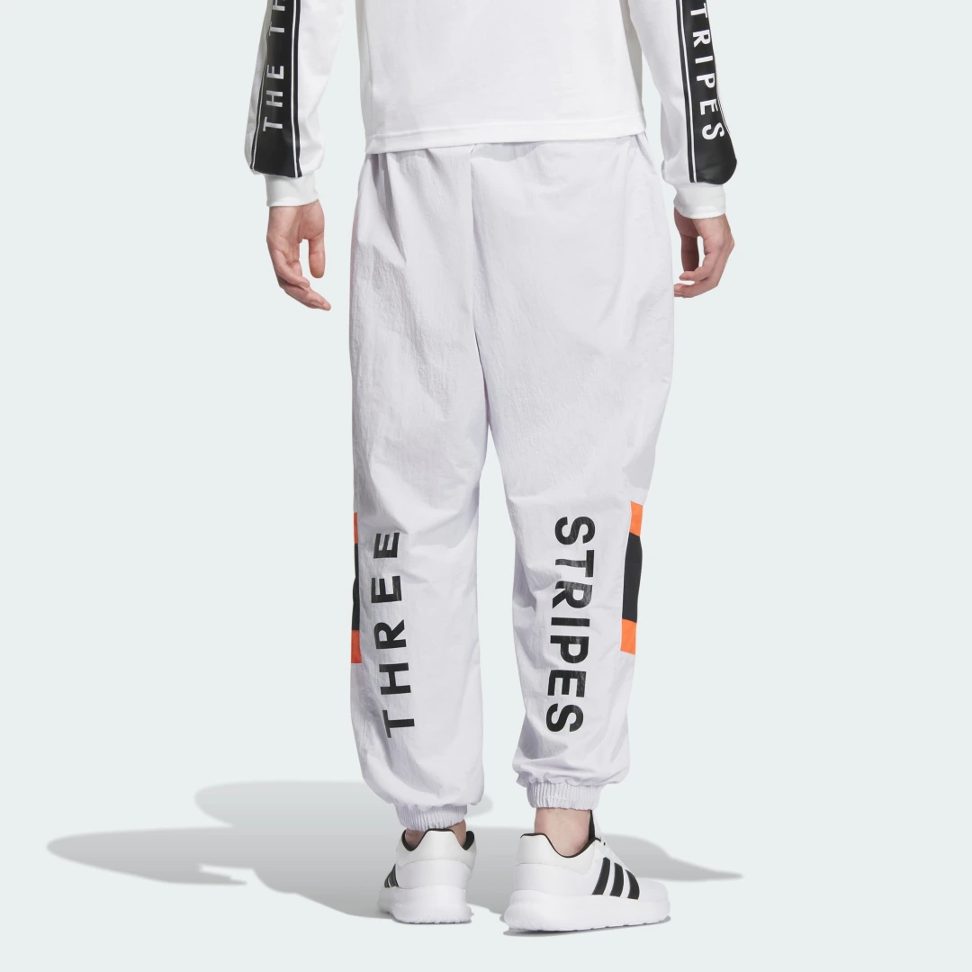 Thumbnail 1 de Wording Pack Loose Fit Mesh-Lined Woven Elastic Hem Joggers de Adidas