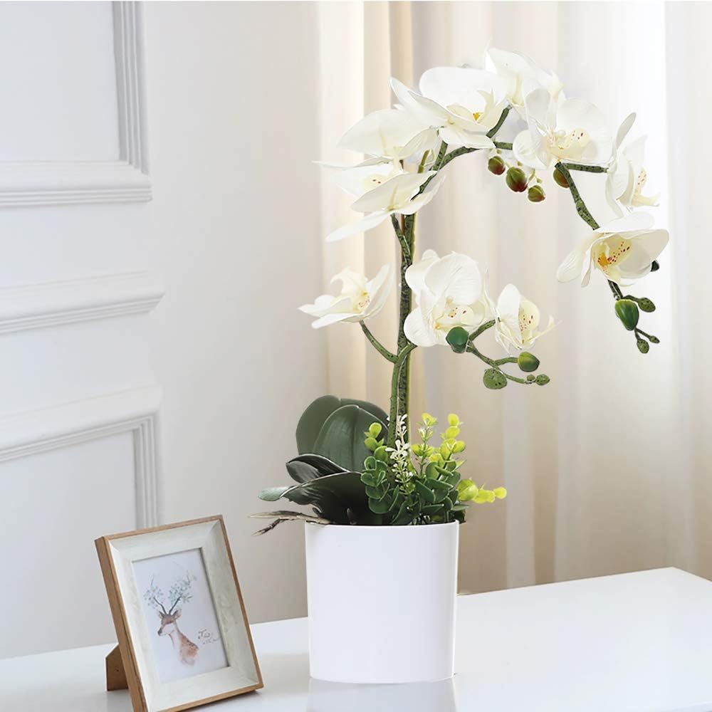 Detalle de Orchidée artificielle blanche dans pot blanc — fleur et plante réalistes pour la maison et le bureau