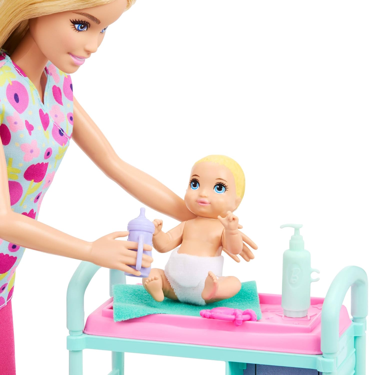 Detalle de Barbie Carriere Pediatra JMK12: set gioco con bambola bionda, neonati e lettino per visite