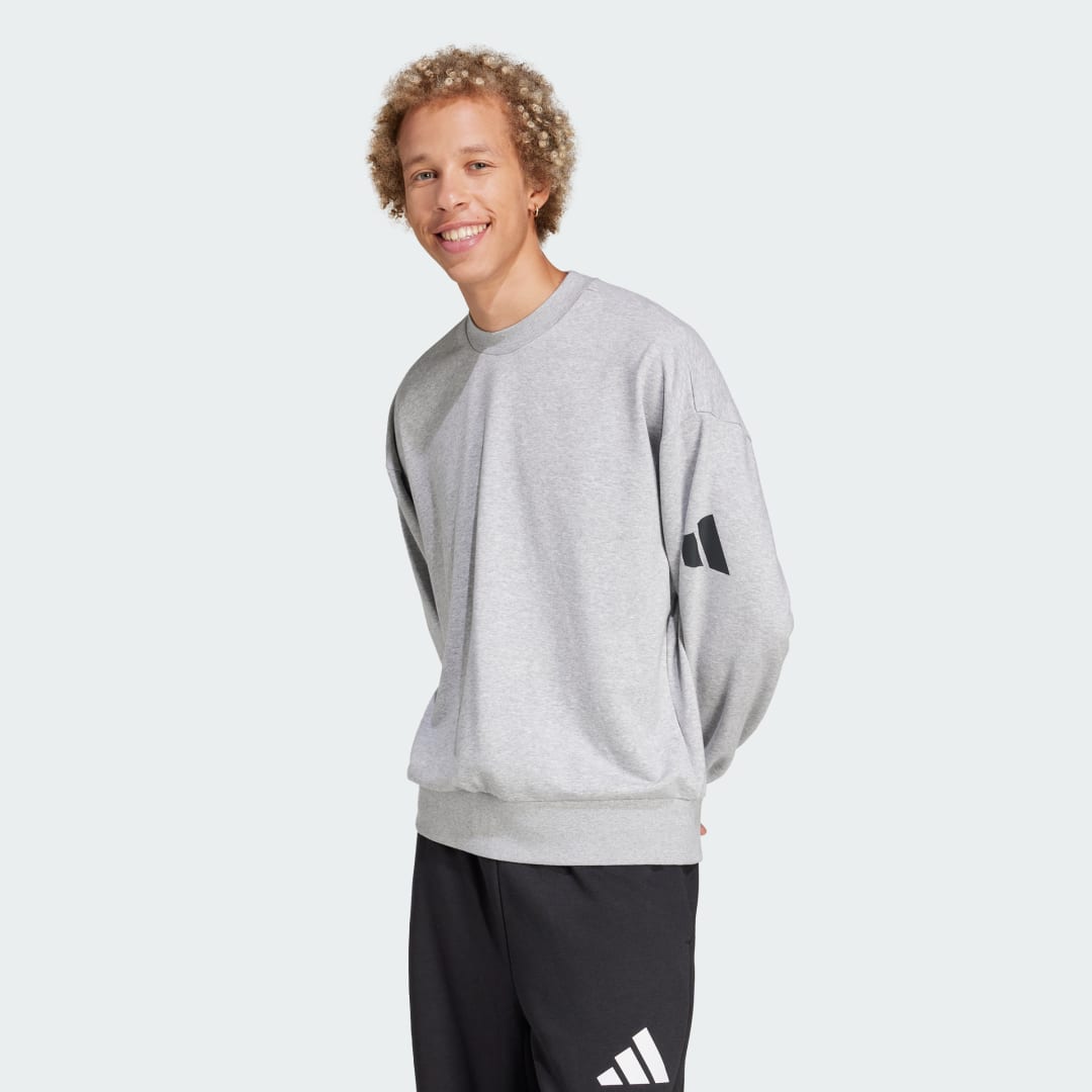 Detalle de Sudadera Essentials Loose Fit 3 Bar Logo de Adidas — guía de compra