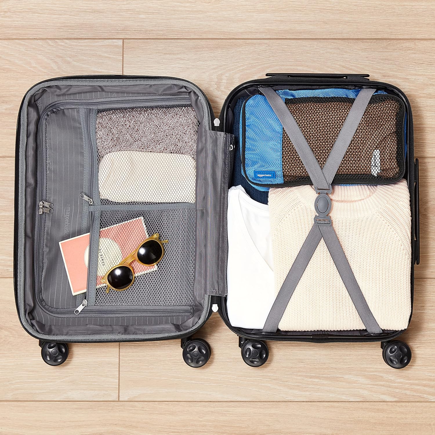 Detalle de Amazon Basics Hartschalen-Koffer Mittelgroß – Erweiterbares ABS-Reisegepäck, Marineblau, 65 l