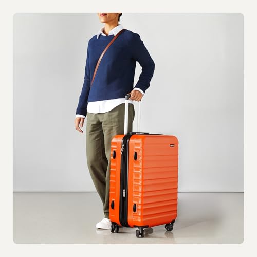 Detalle de Amazon Basics Valigia Rigida Media Espandibile ABS a 4 Ruote Doppie Girevoli – 65 L, Colore Arancione Bruciato