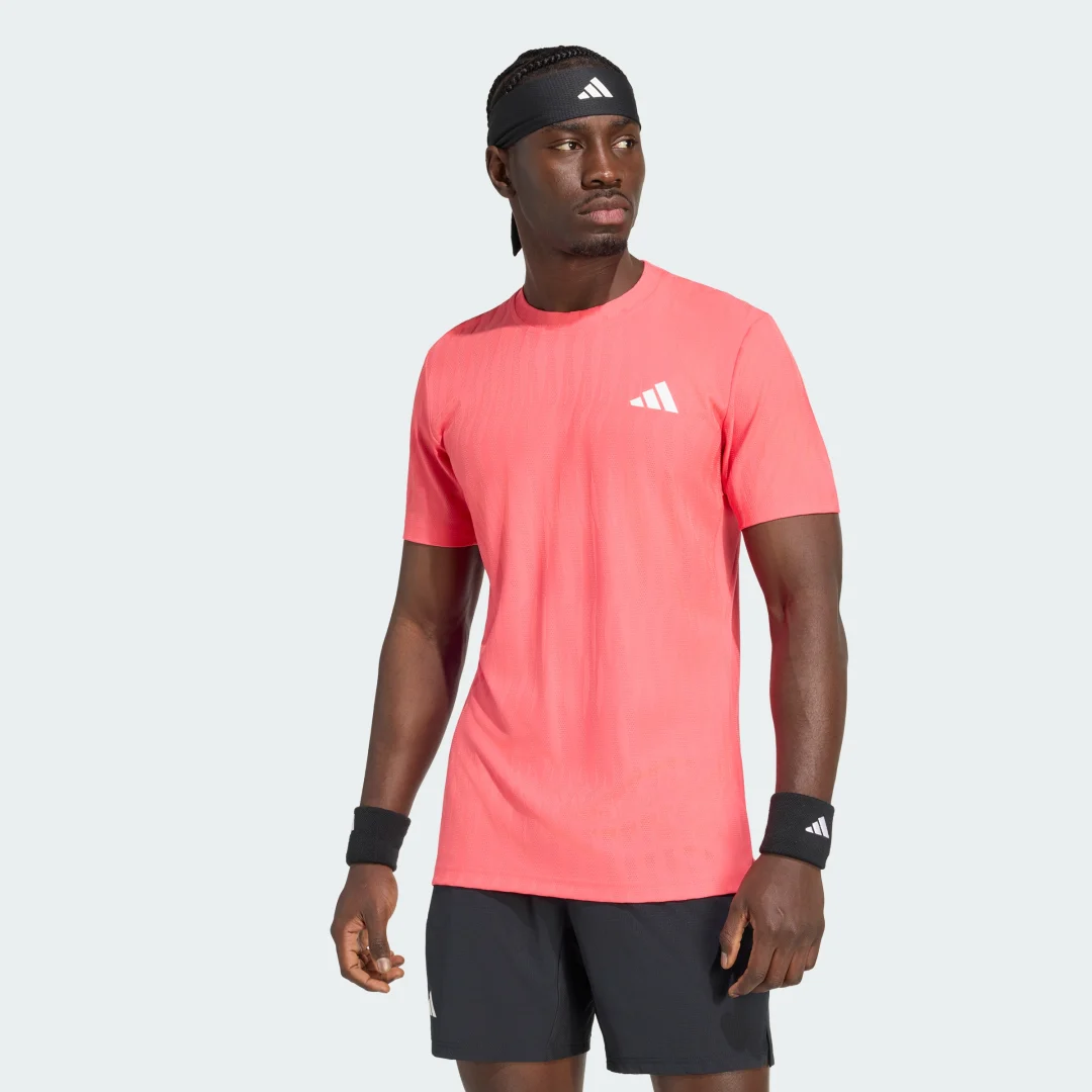 Imagen de Camiseta de tenis Climacool+ AirChill Freelift de Adidas: cómoda, transpirable y pensada para movimientos amplios en OfertitasTOP